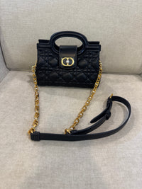Bolso negro CD MNO